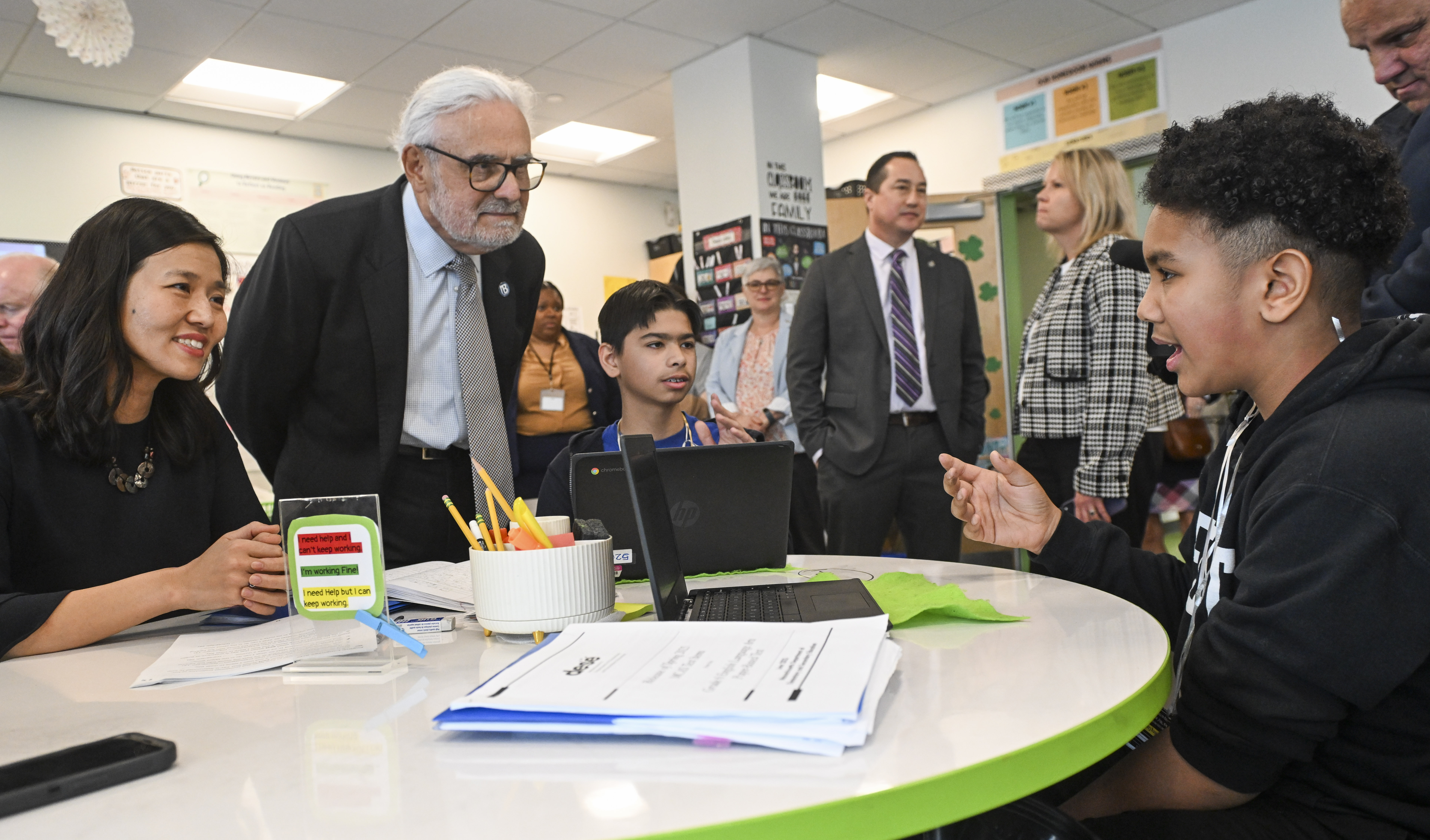 Mayor Wu and Chancellor Suarez-Orozco talking with BPS students in a classroom
